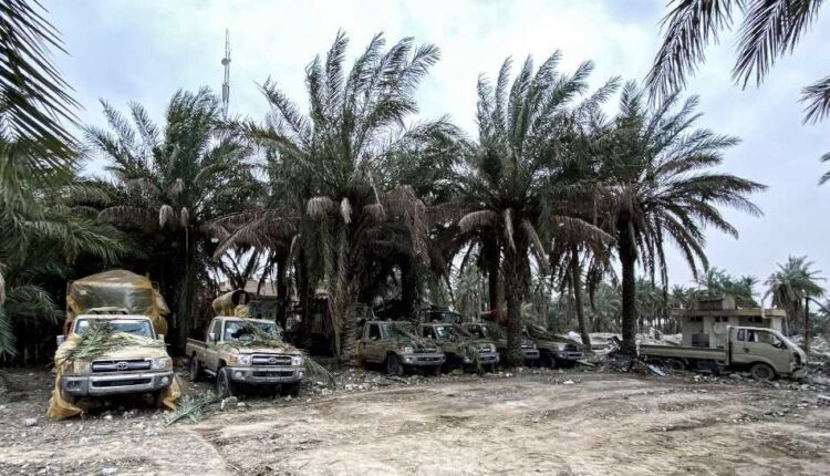 This picture taken on March 13, 2020 shows damaged military vehicles in the aftermath of US military air strikes at a militarised zone in the Jurf al-Sakhr area in Iraq's Babylon province (south of the capital) controlled by Kataeb Hezbollah, a hardline faction of the Hashed al-Shaabi (Popular Mobilisation) forces paramilitaries. - US air strikes targeting pro-Iranian military factions in Iraq killed one civilian and five security personnel early on March 13, the Iraqi military said, warning the raids risked a bloody escalation for the war-battered country. The Pentagon said the strikes were in retaliation for rocket fire against an Iraqi base the night of March 12 that killed one British and two US military personnel in the deadliest such attack in years. (Photo by AFP)