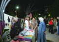 Jin ji bo keda destên xwe li Parka 75an stand vekirin